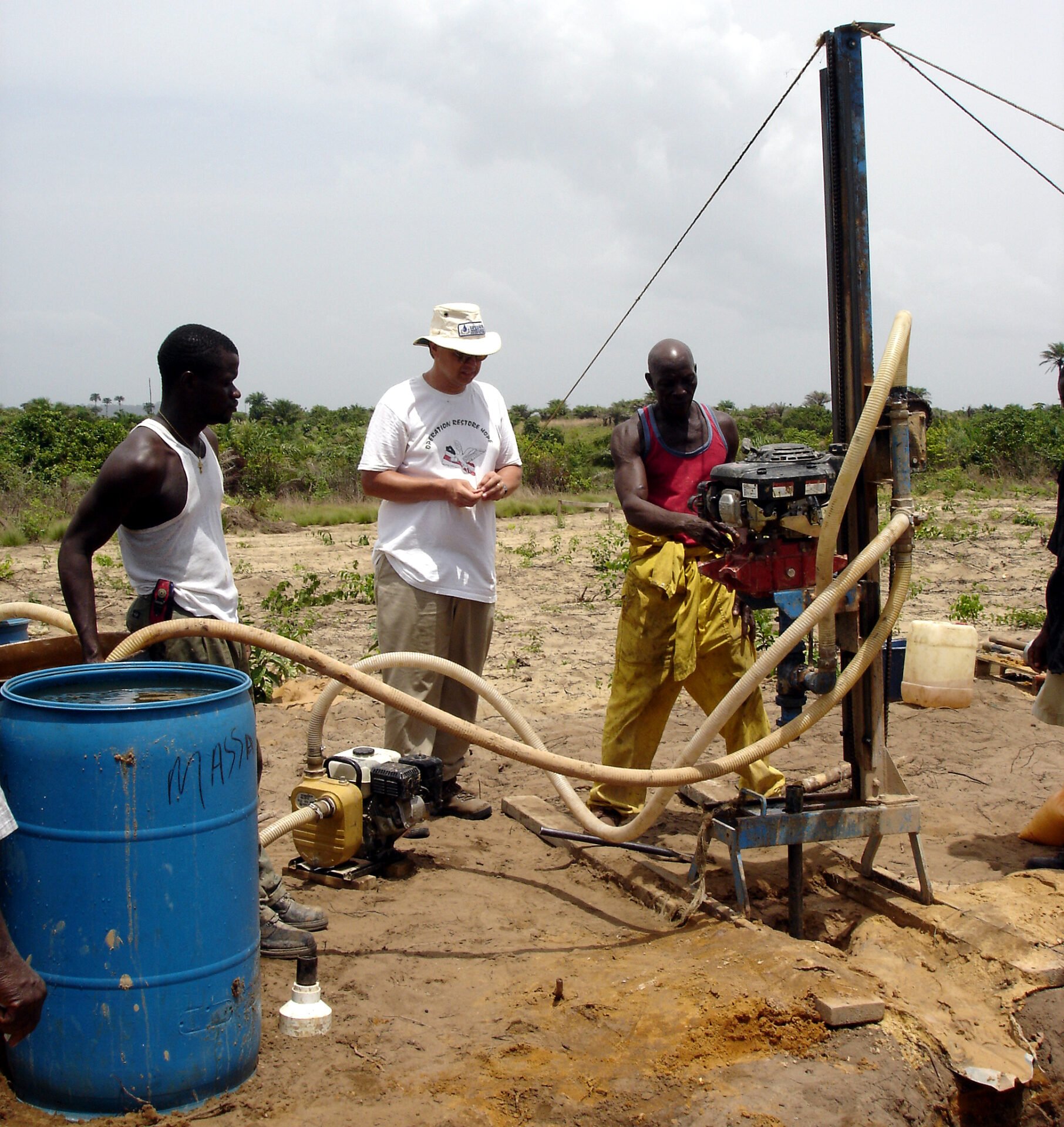 Mechanical drill digging water well in Africa