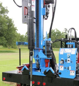 Trailer mounted soil sampling safety hammer