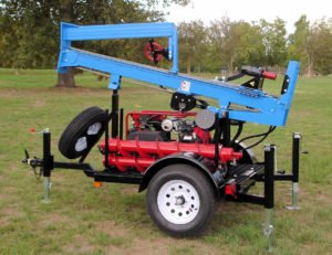 Trailer mounted geotechnical drill mast folded for travel